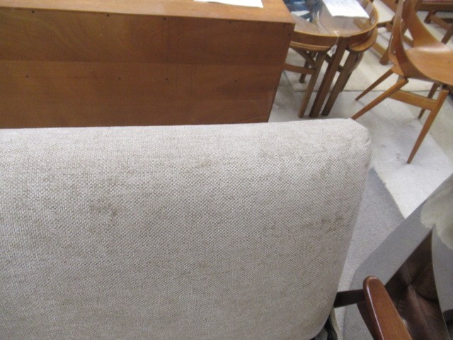 A RETRO TEAK FRAMED LOUNGE SUITE, c.1960's, upholstered in a pale mushroom chenille, comprising a Image