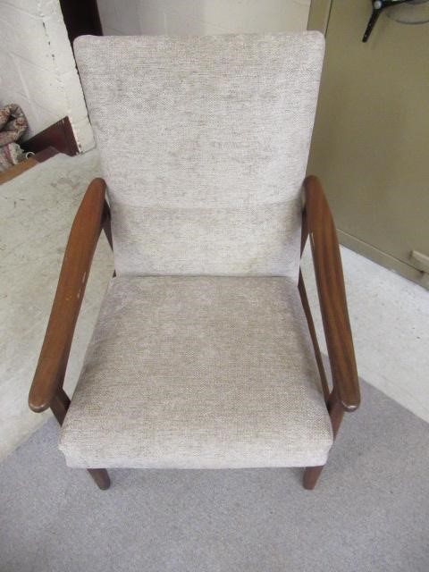 A RETRO TEAK FRAMED LOUNGE SUITE, c.1960's, upholstered in a pale mushroom chenille, comprising a Image