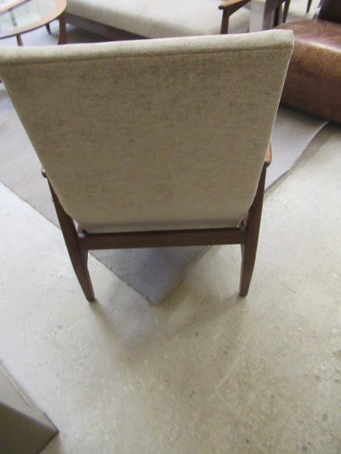 A RETRO TEAK FRAMED LOUNGE SUITE, c.1960's, upholstered in a pale mushroom chenille, comprising a Image