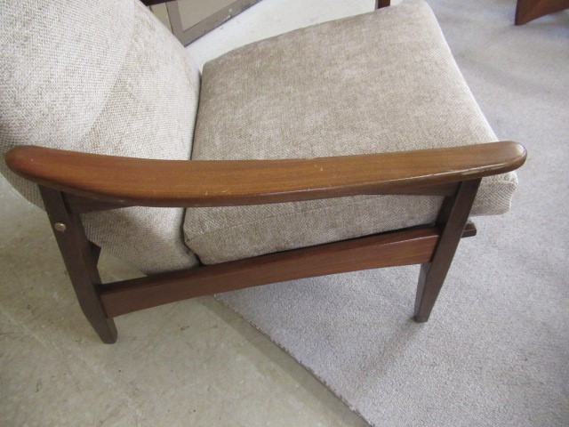 A RETRO TEAK FRAMED LOUNGE SUITE, c.1960's, upholstered in a pale mushroom chenille, comprising a Image