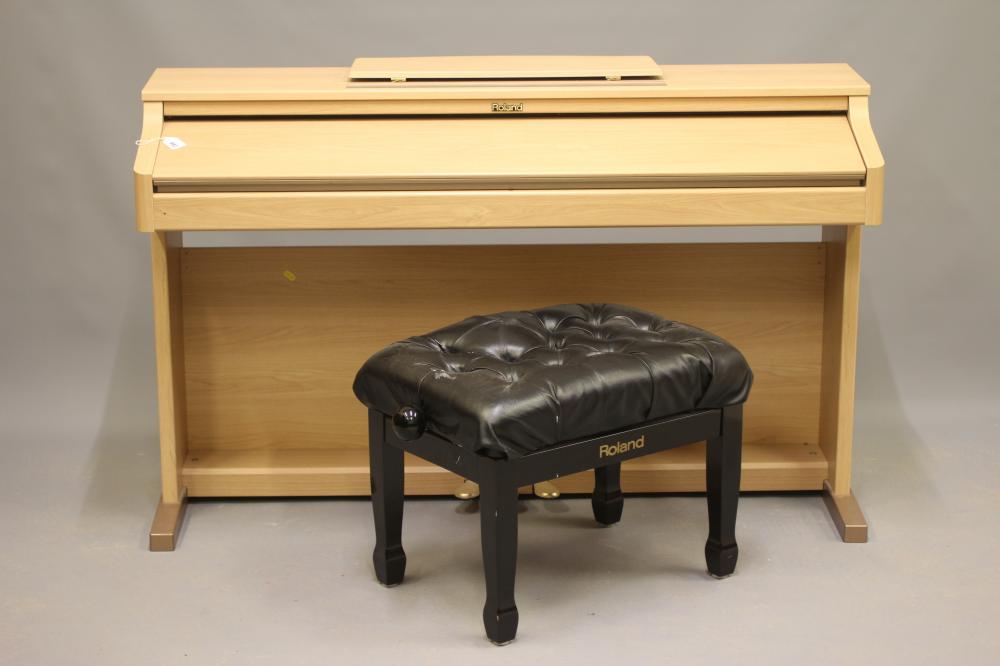 A ROLAND HP2E DIGITAL PIANO, modern, serial number ZR61208, in light oak veneered case, 55" w x 18 Image