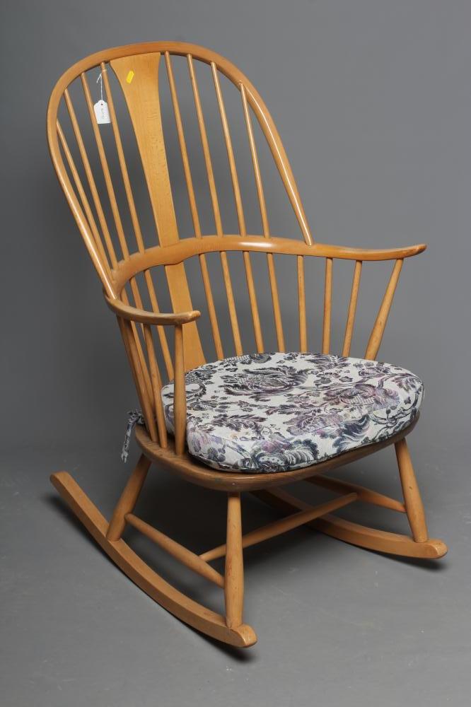 AN ERCOL COW HORN ROCKING CHAIR, mid 20th century, in blond beech and elm, the high hooped spindle Image