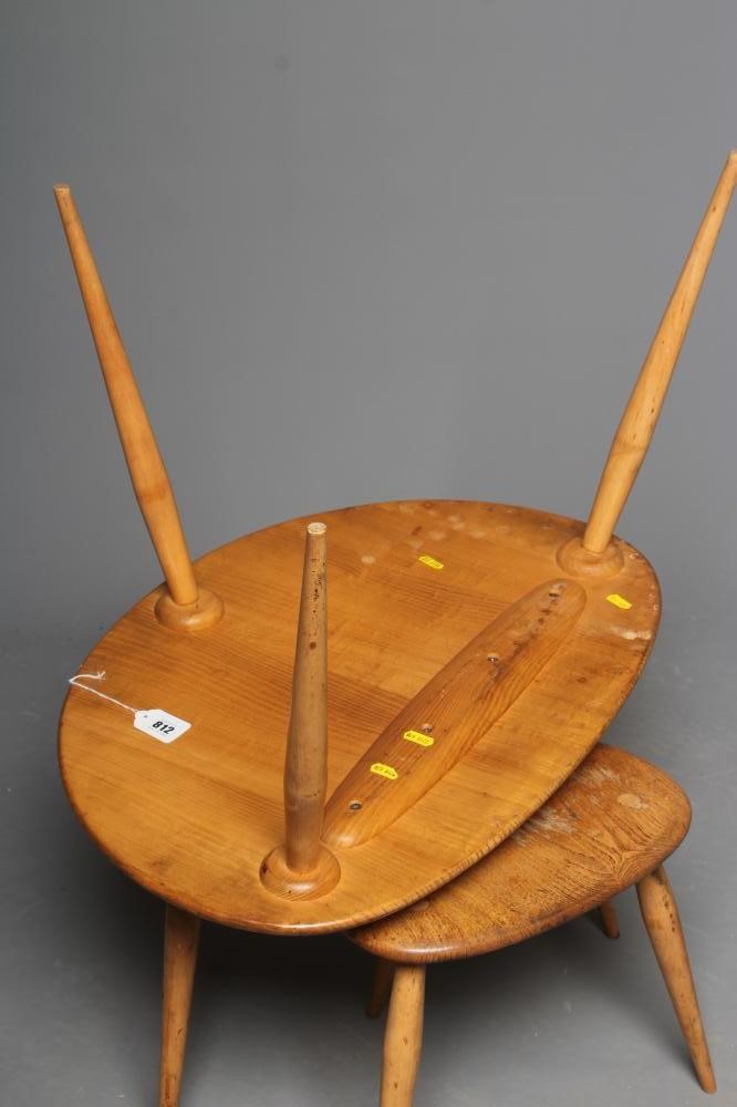 AN ERCOL NEST OF "PEBBLE" TABLES, late 20th century, the blond elm tops on beech legs, largest 26" w Image