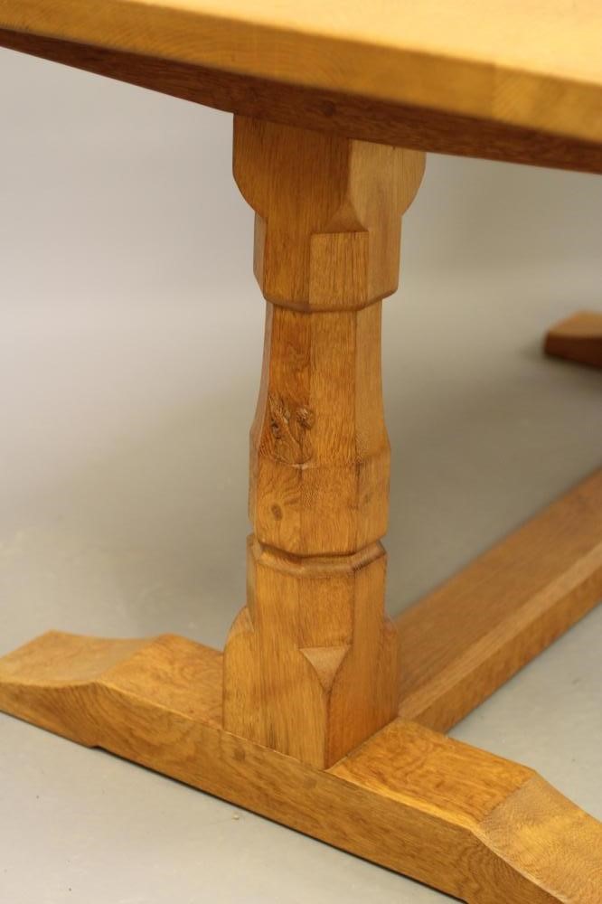 WILFRED HUTCHINSON (HUSTHWAITE) AN ADZED OAK DINING TABLE Image