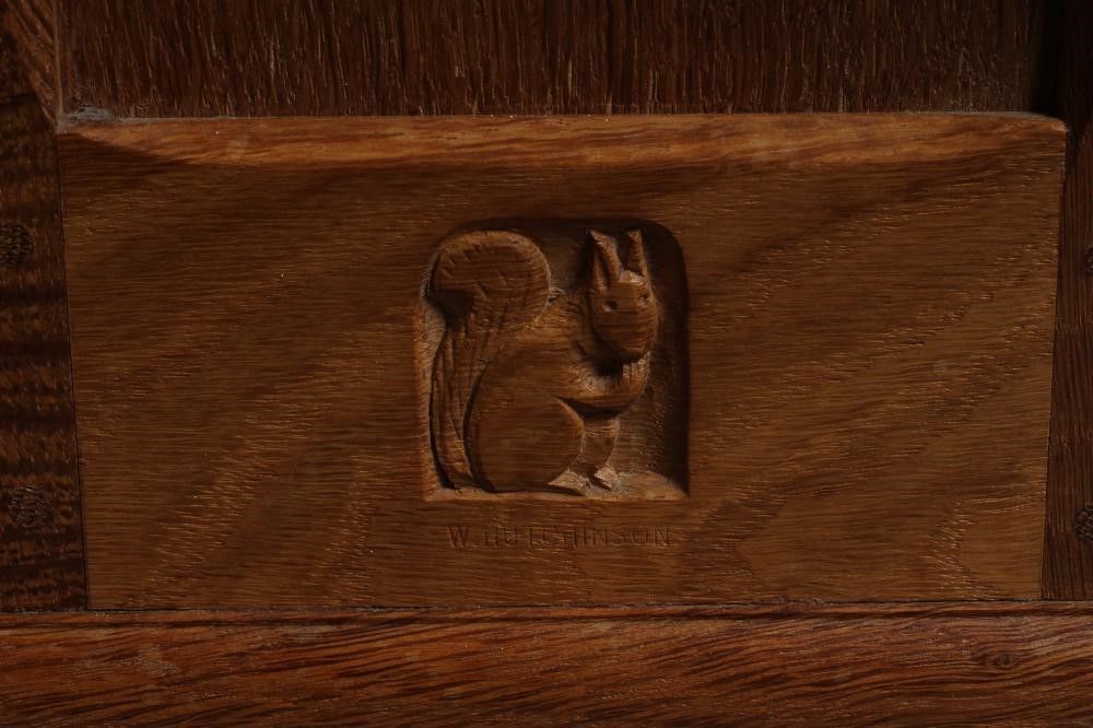 WILFRED HUTCHINSON (HUSTHWAITE) AN OAK STANDING CORNER CUPBOARD Image