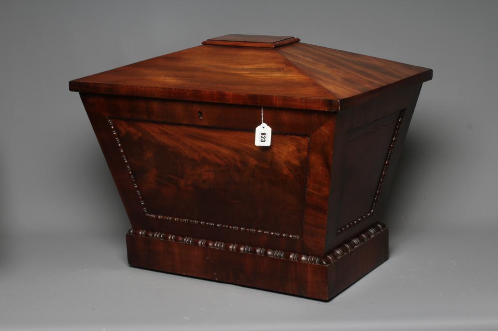 A REGENCY MAHOGANY CELLARETTE, early 19th century, of sarcophagus form with bead and reel edging, Image