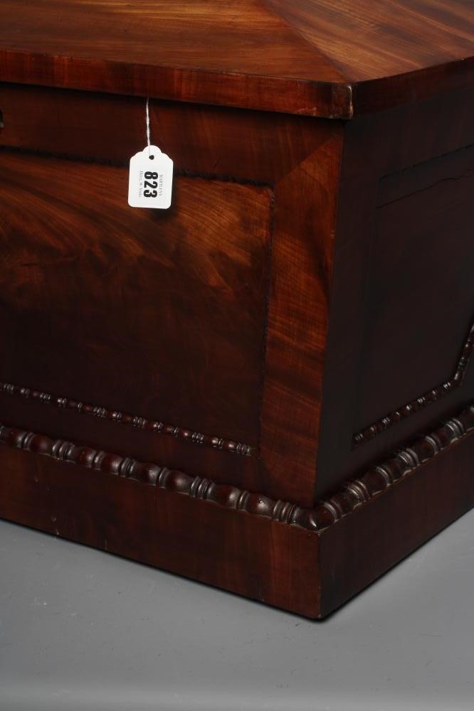 A REGENCY MAHOGANY CELLARETTE, early 19th century, of sarcophagus form with bead and reel edging, Image