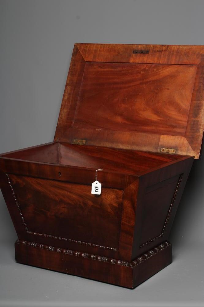 A REGENCY MAHOGANY CELLARETTE, early 19th century, of sarcophagus form with bead and reel edging, Image