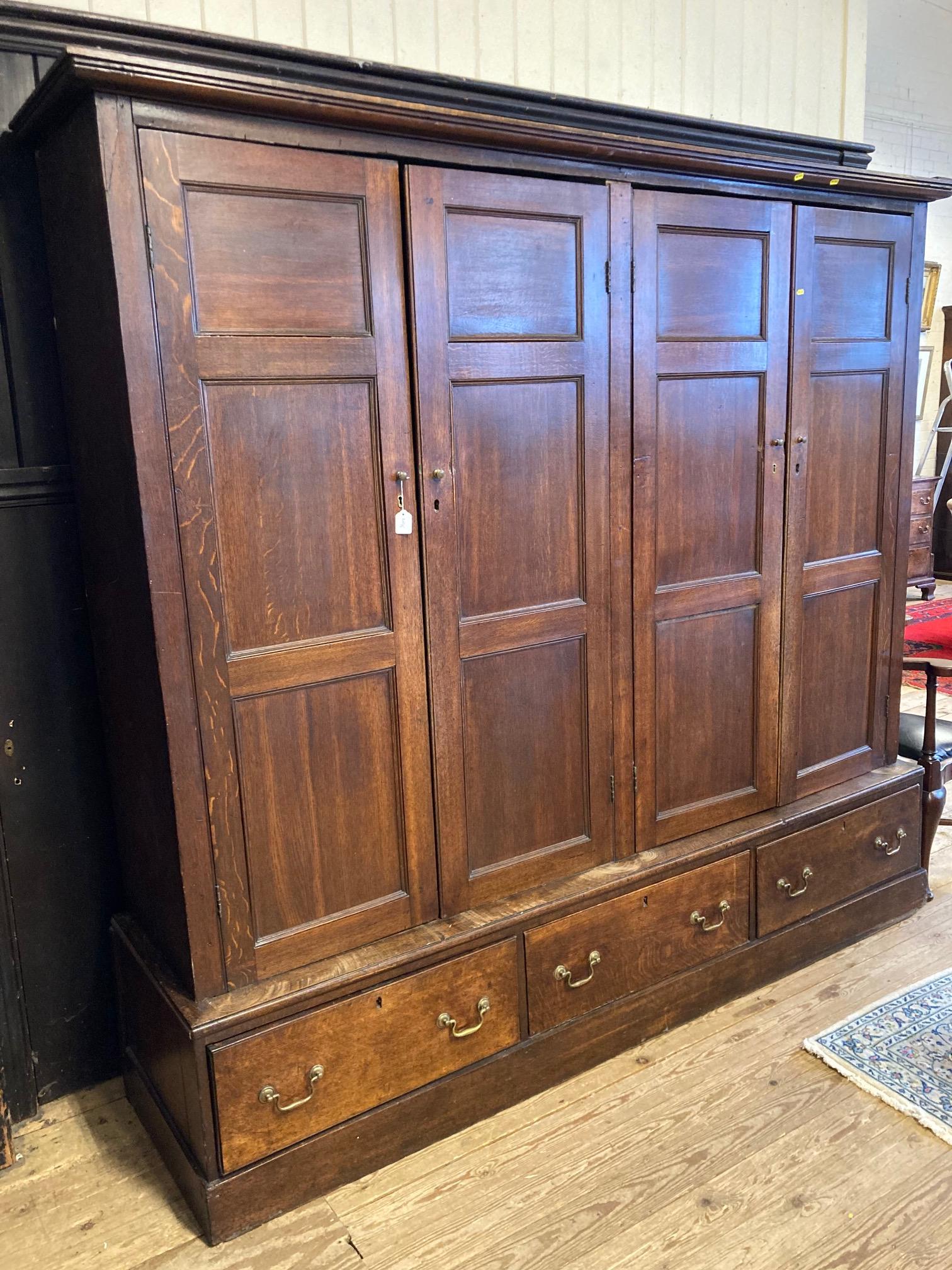 A LARGE GEORGIAN OAK ESTATE CUPBOARD Image