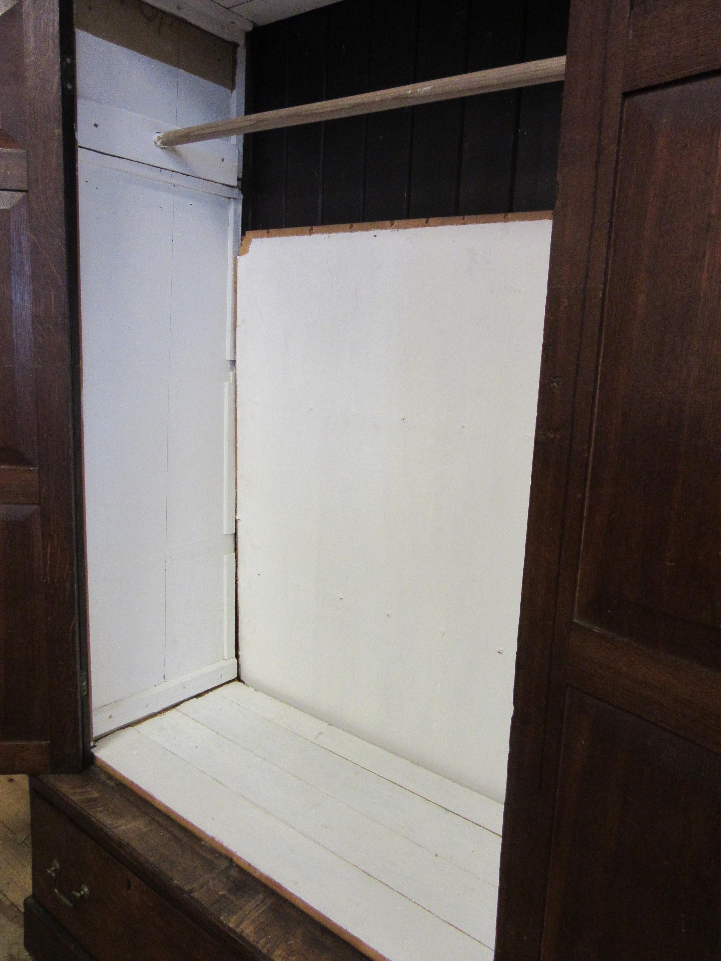 A LARGE GEORGIAN OAK ESTATE CUPBOARD Image