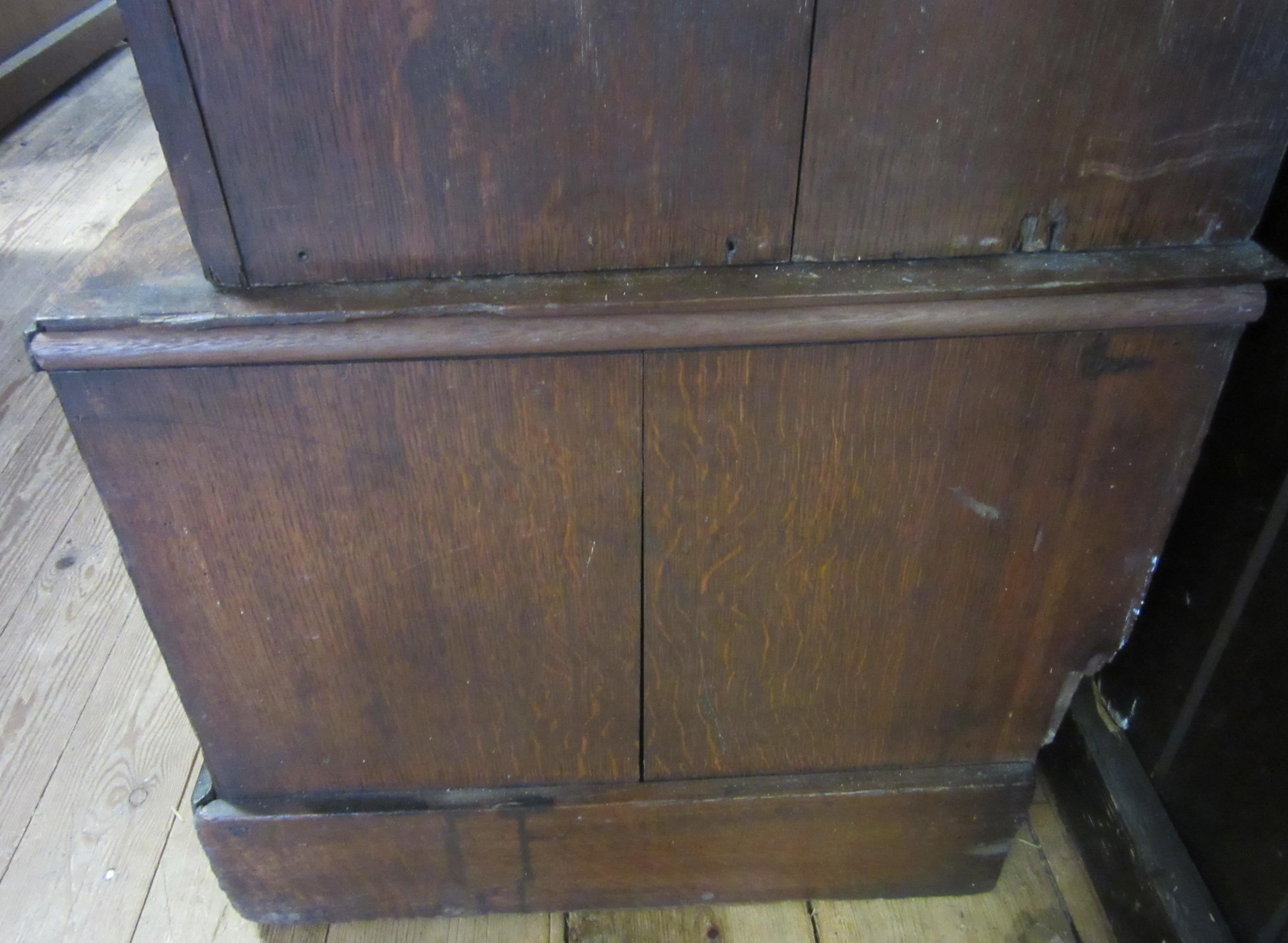 A LARGE GEORGIAN OAK ESTATE CUPBOARD Image