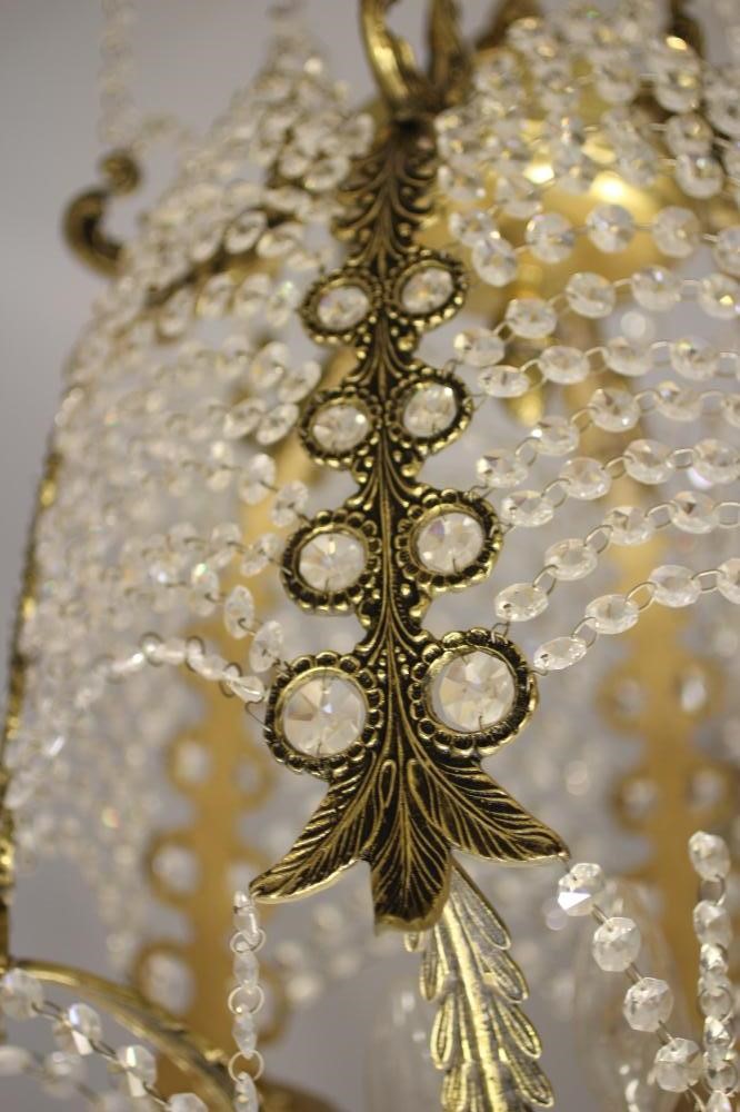 A GILT METAL CHANDELIER Image