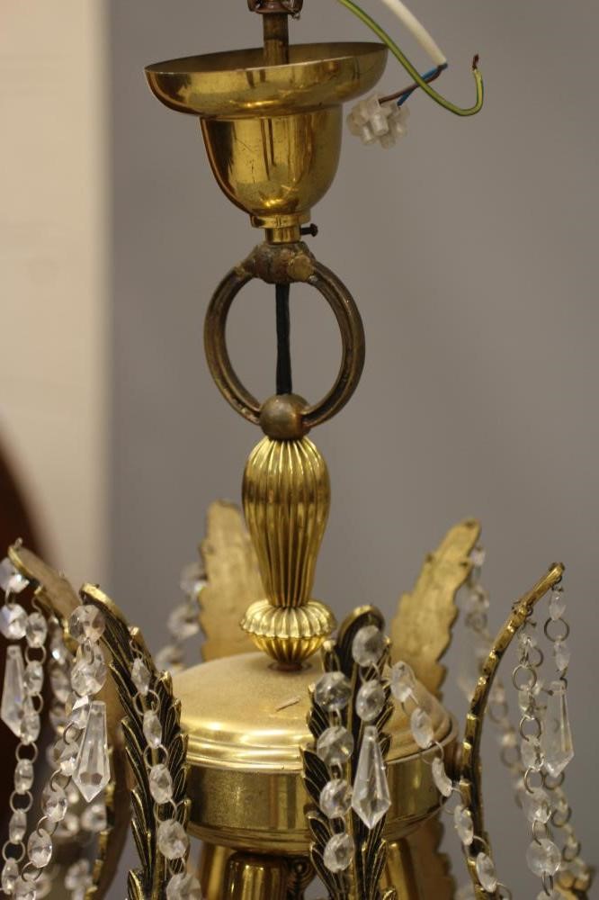 A GILT METAL CHANDELIER Image