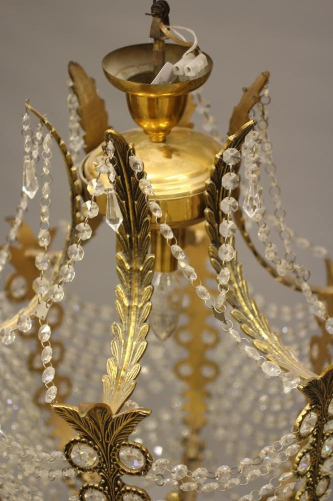 A GILT METAL CHANDELIER Image