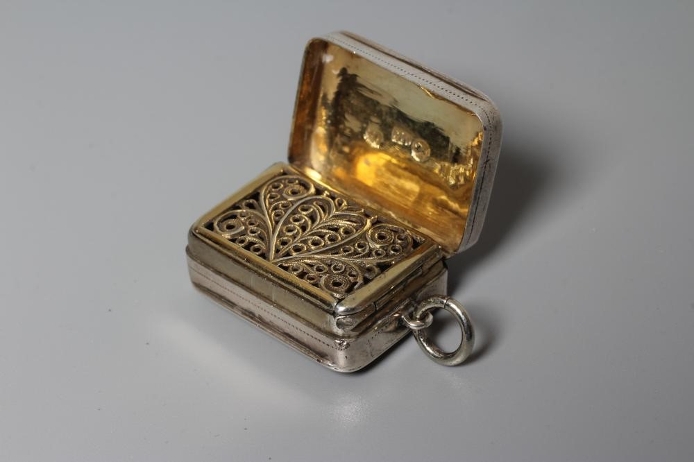 A GEORGE III SILVER HANGING VINAIGRETTE by Matthew Linwood, Birmingham 1802, of plain rounded oblong Image
