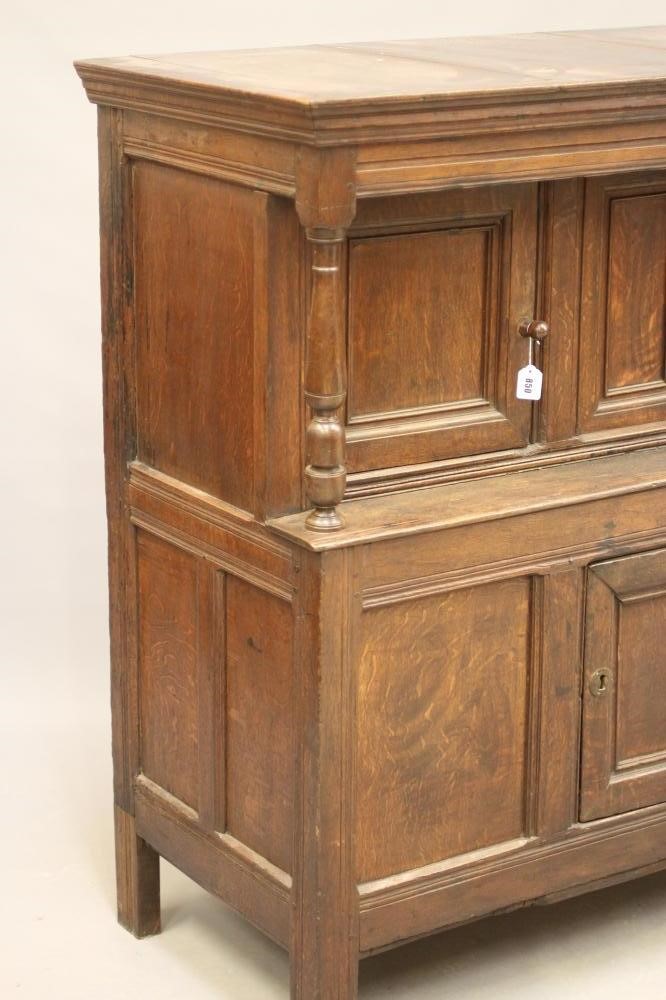 A JOINED OAK PRESS CUPBOARD Image