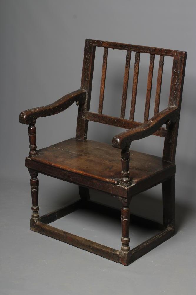 A LARGE JOINED OAK ARMCHAIR Image