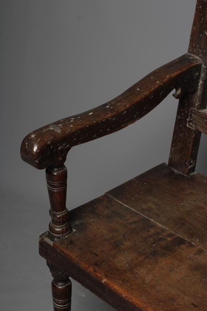 A LARGE JOINED OAK ARMCHAIR Image