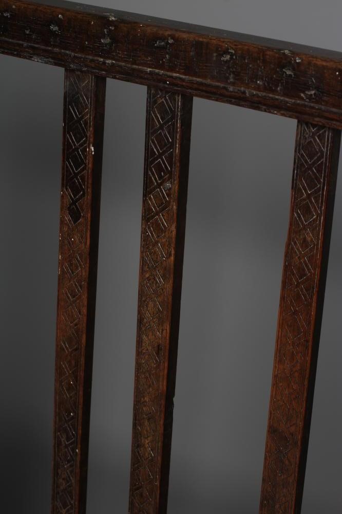 A LARGE JOINED OAK ARMCHAIR Image