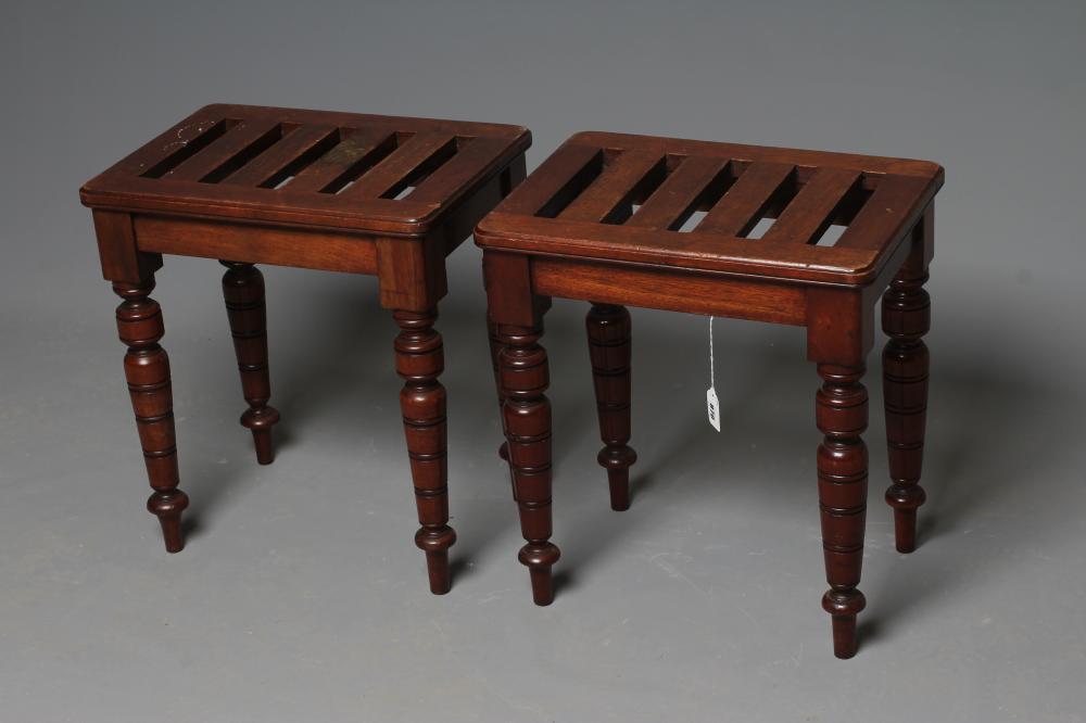 A PAIR OF VICTORIAN LUGGAGE STANDS, late 19th century, the moulded edged rounded oblong slatted top Image