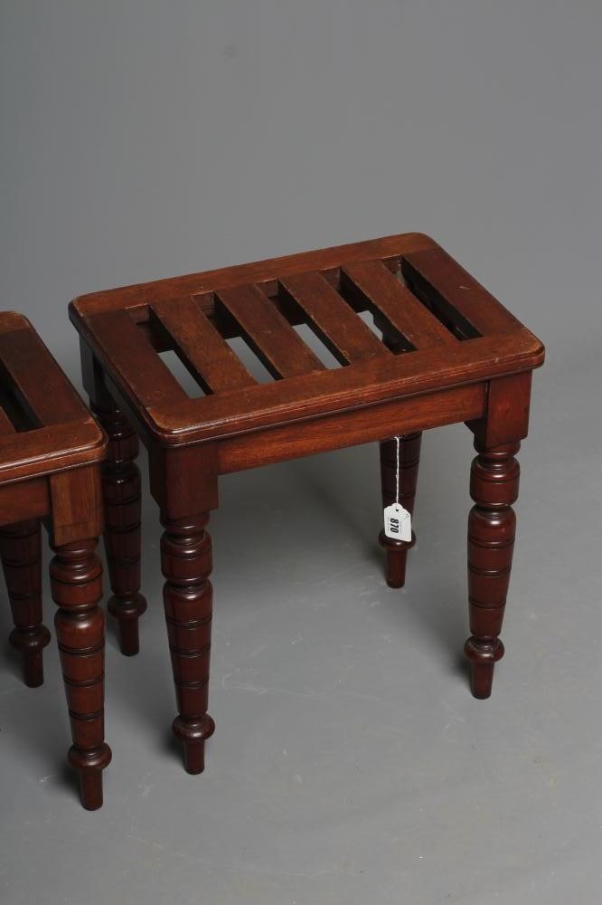 A PAIR OF VICTORIAN LUGGAGE STANDS, late 19th century, the moulded edged rounded oblong slatted top Image