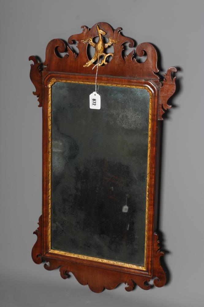 A GEORGIAN MAHOGANY FRET MIRROR, early 19th century, the mildly arched plate within a moulded Image