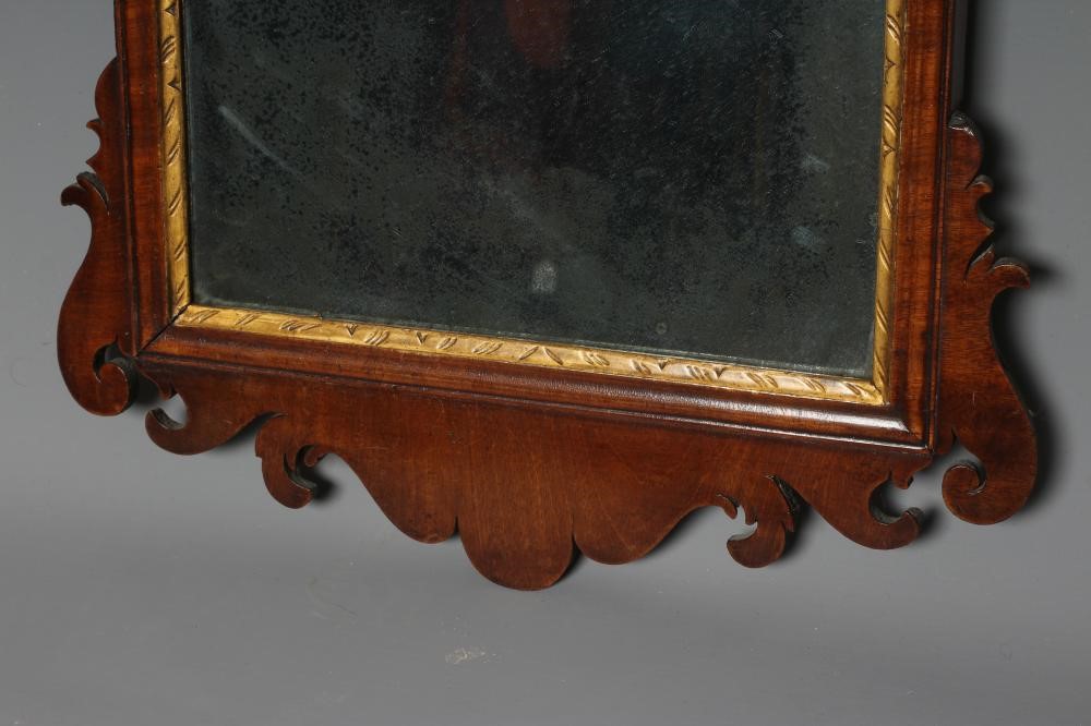 A GEORGIAN MAHOGANY FRET MIRROR, early 19th century, the mildly arched plate within a moulded Image