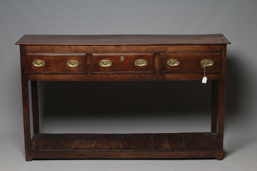 A GEORGIAN OAK POTBOARD DRESSER, early 19th century, the single plank top over three moulded edged Image