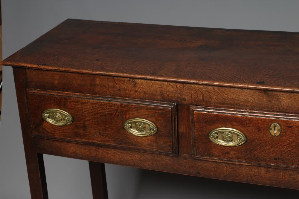 A GEORGIAN OAK POTBOARD DRESSER, early 19th century, the single plank top over three moulded edged Image