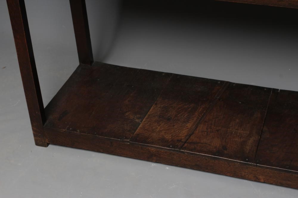 A GEORGIAN OAK POTBOARD DRESSER, early 19th century, the single plank top over three moulded edged Image