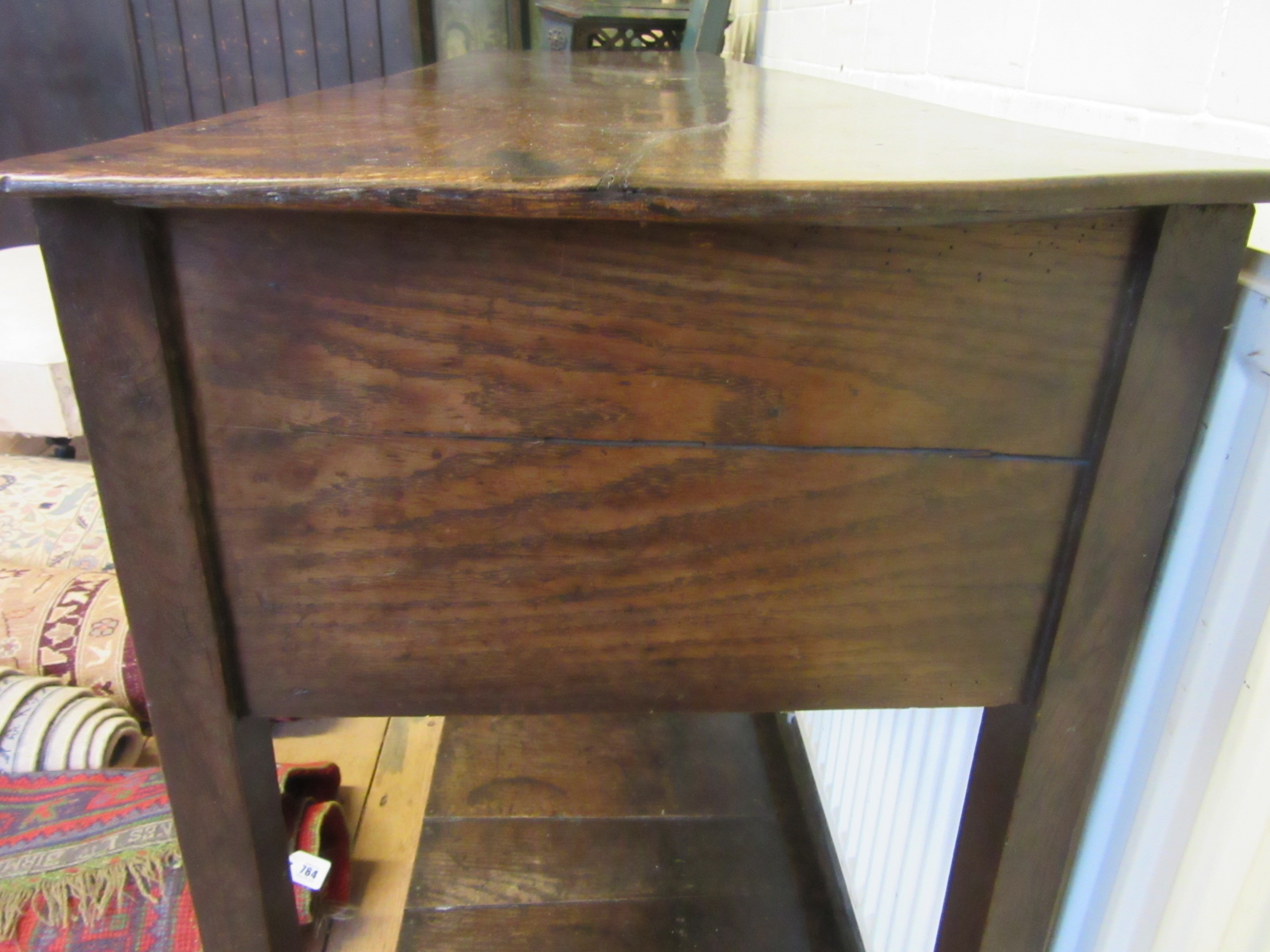 A GEORGIAN OAK POTBOARD DRESSER, early 19th century, the single plank top over three moulded edged Image