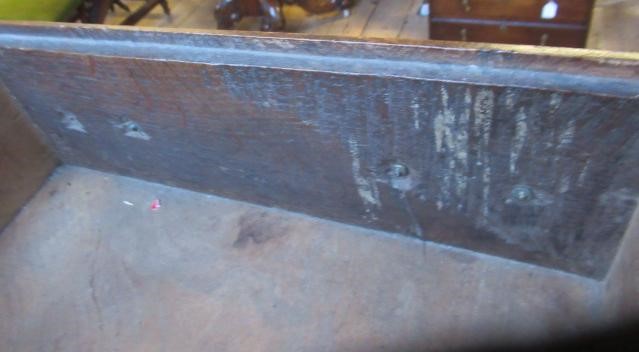 A GEORGIAN OAK POTBOARD DRESSER, early 19th century, the single plank top over three moulded edged Image