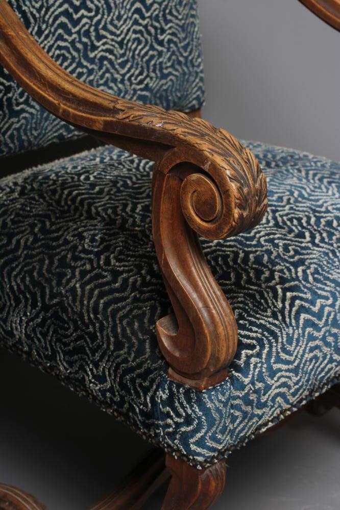 A CARVED WALNUT ARMCHAIR Image