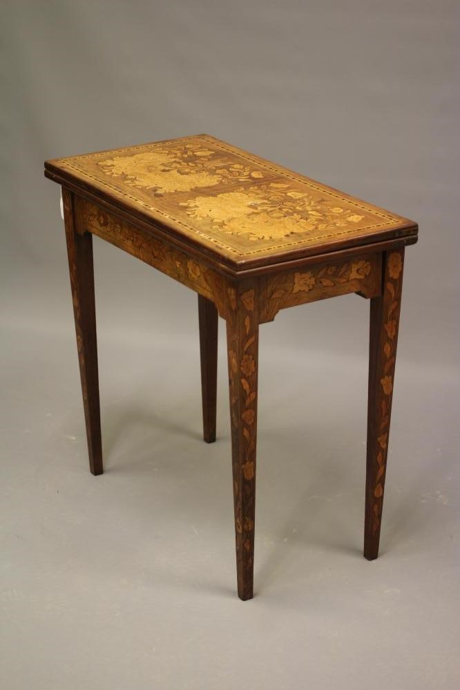 A DUTCH WALNUT AND MARQUETRY FOLDING CARD TABLE Image