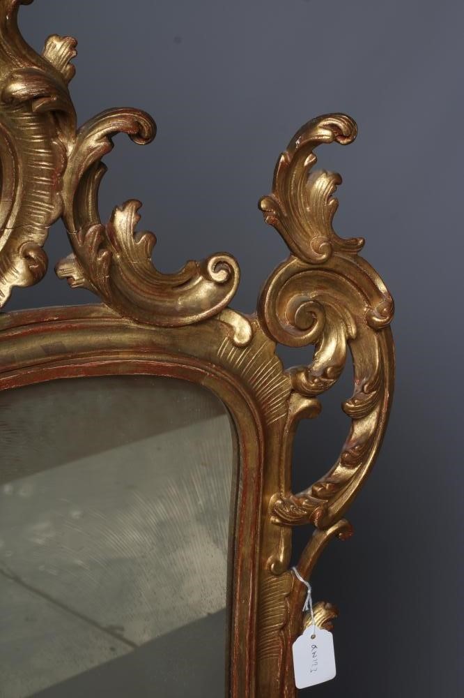A MID GEORGIAN STYLE GILT WOOD PIER GLASS, 20th century, in the rococo taste, the oblong plate Image