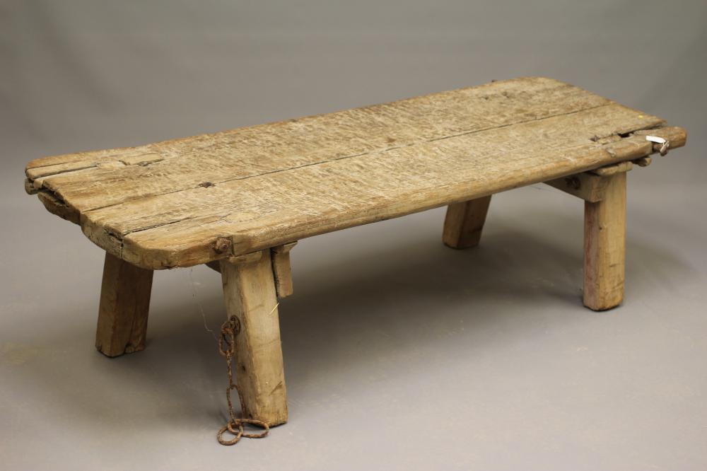 AN ELM PIG BENCH, 19th century, of traditional form, the twin plank top of splayed square section Image