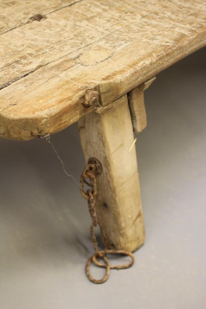 AN ELM PIG BENCH, 19th century, of traditional form, the twin plank top of splayed square section Image