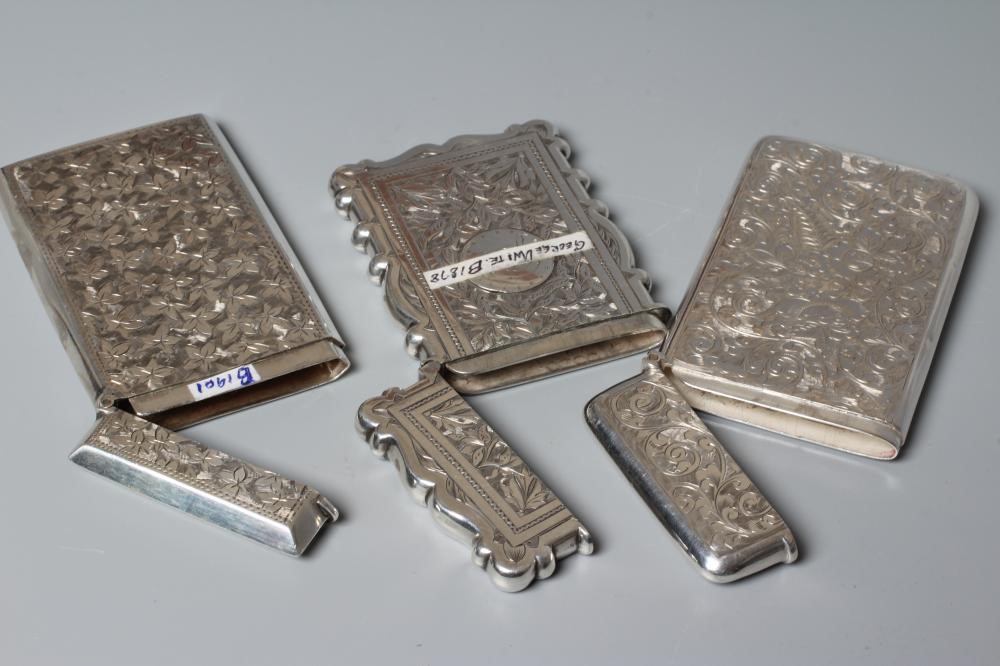 THREE VICTORIAN SILVER VISITING CARD CASES all of vertical oblong form with bright cut engraving Image