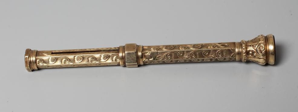 A LATE VICTORIAN TELESCOPIC PENCIL by Henry Griffith & Sons Ltd., stamped 9CT, of hexagonal form Image