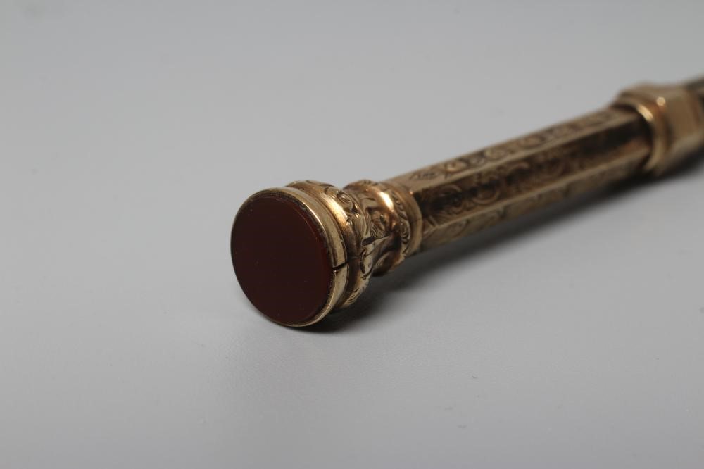 A LATE VICTORIAN TELESCOPIC PENCIL by Henry Griffith & Sons Ltd., stamped 9CT, of hexagonal form Image