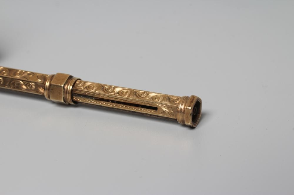 A LATE VICTORIAN TELESCOPIC PENCIL by Henry Griffith & Sons Ltd., stamped 9CT, of hexagonal form Image