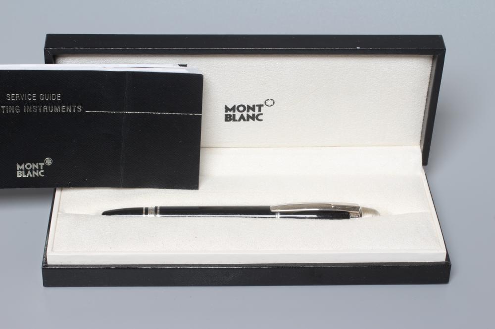 A MONT BLANC BLACK STAR WALKER ROLLERBALL PEN, post 1997, resin with platinum plated mounts, serial Image