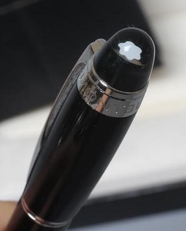 A MONT BLANC BLACK STAR WALKER ROLLERBALL PEN, post 1997, resin with platinum plated mounts, serial Image