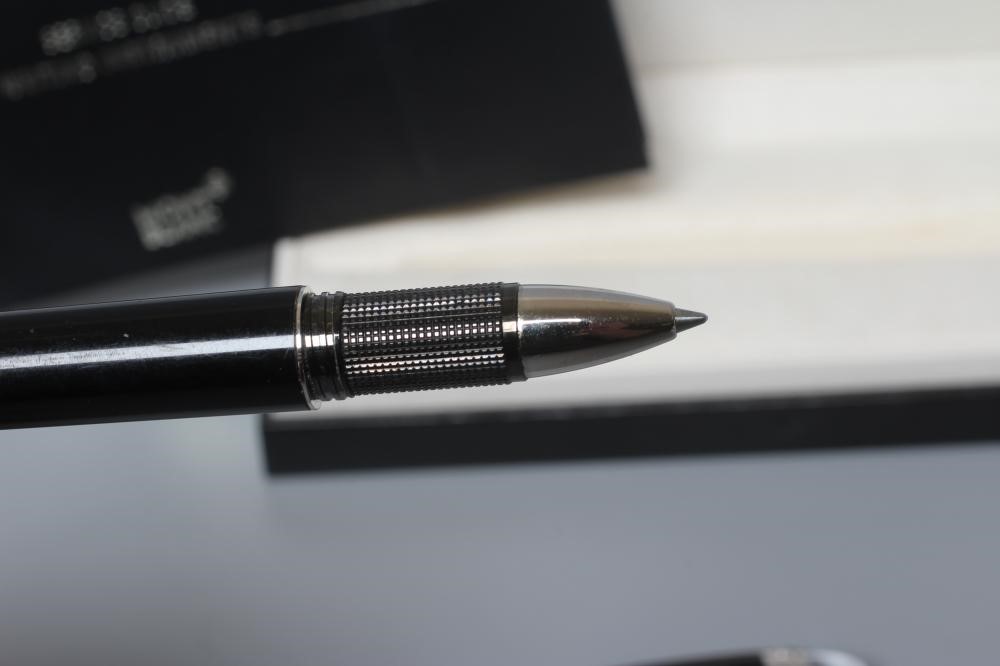 A MONT BLANC BLACK STAR WALKER ROLLERBALL PEN, post 1997, resin with platinum plated mounts, serial Image