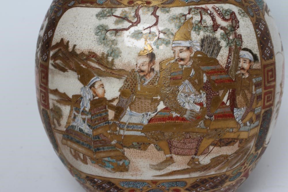 A SATSUMA EARTHENWARE DOUBLE GOURD VASE painted in typical enamels and gilt with two panels of Image