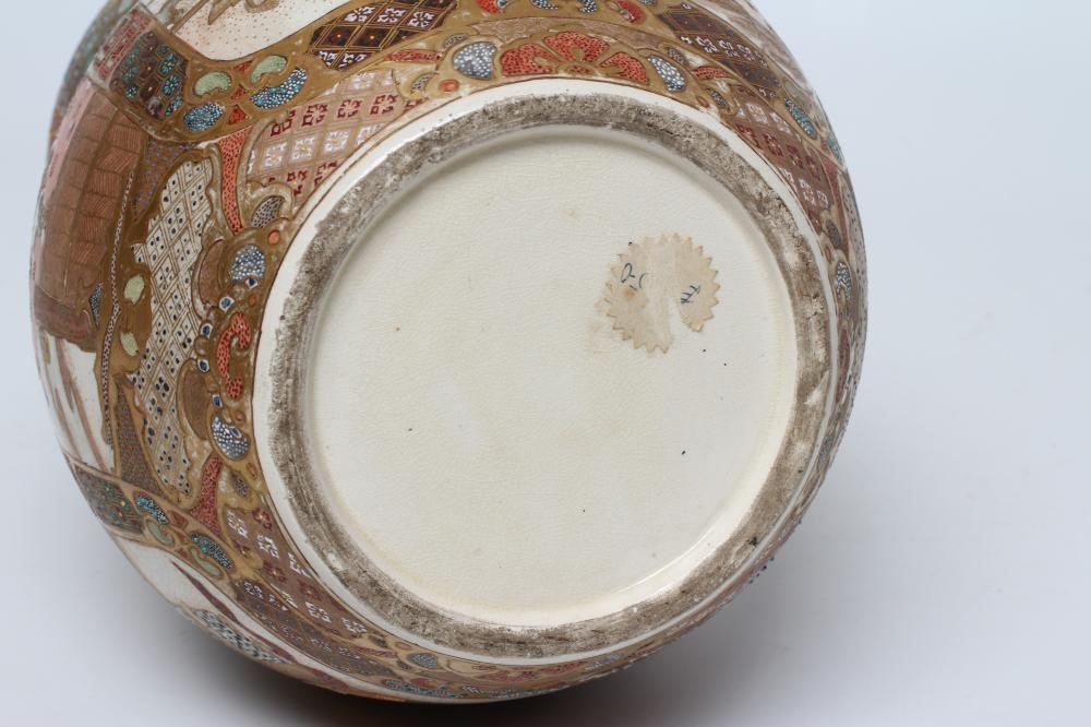 A SATSUMA EARTHENWARE DOUBLE GOURD VASE painted in typical enamels and gilt with two panels of Image