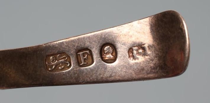 A LATE GEORGE III SILVER CADDY SPOON Image