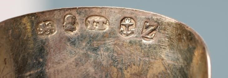 A LATE GEORGE III SILVER CADDY SPOON Image