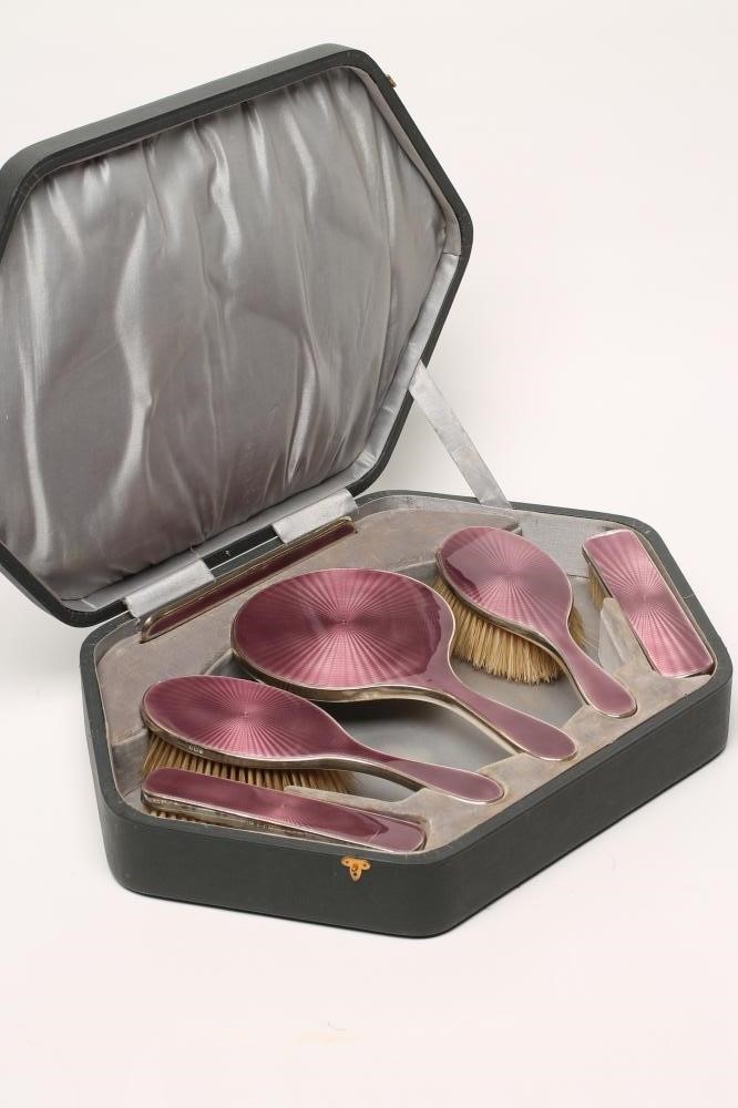 A LADY'S ART DECO LILAC GUILLOCHE ENAMEL AND SILVER EXTENSIVE BOUDOIR SET Image
