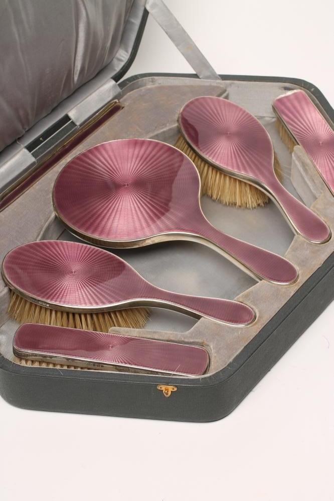 A LADY'S ART DECO LILAC GUILLOCHE ENAMEL AND SILVER EXTENSIVE BOUDOIR SET Image